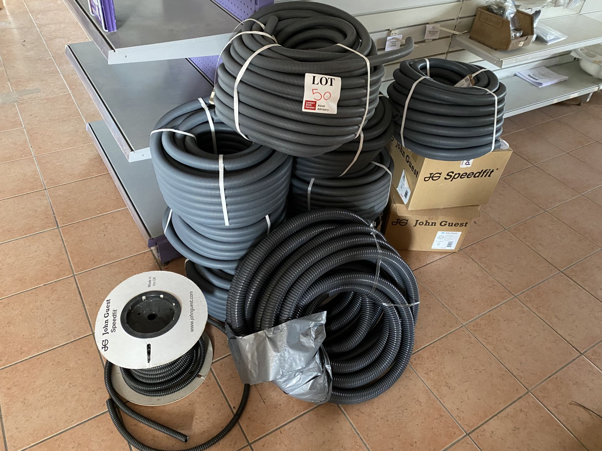 Approx ten reels of various sized plastic piping