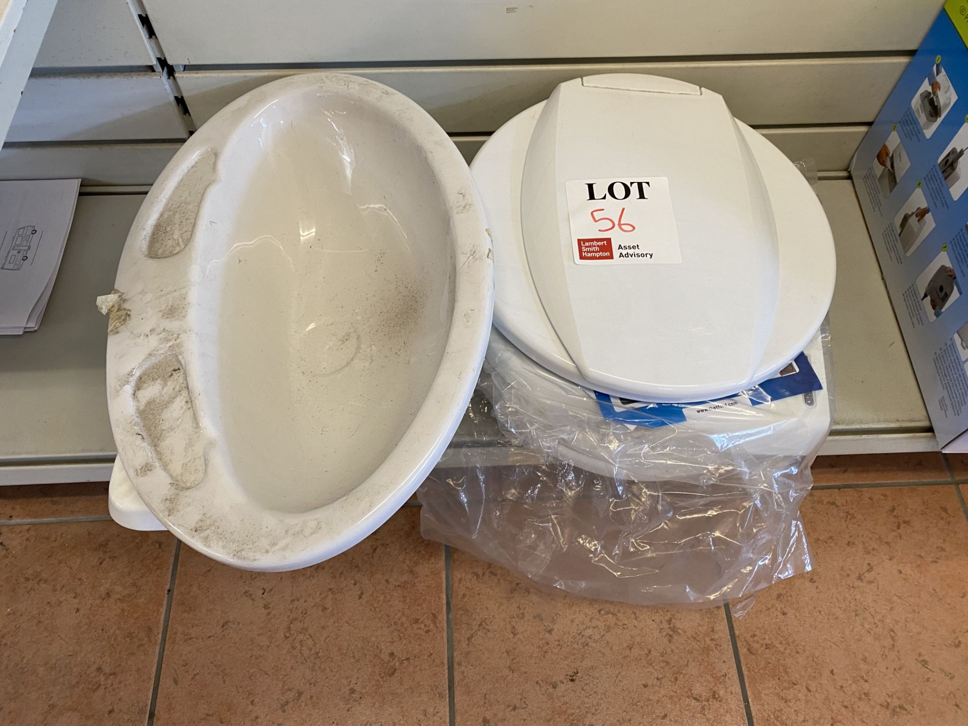 Various plastic toilet seats and washing basins