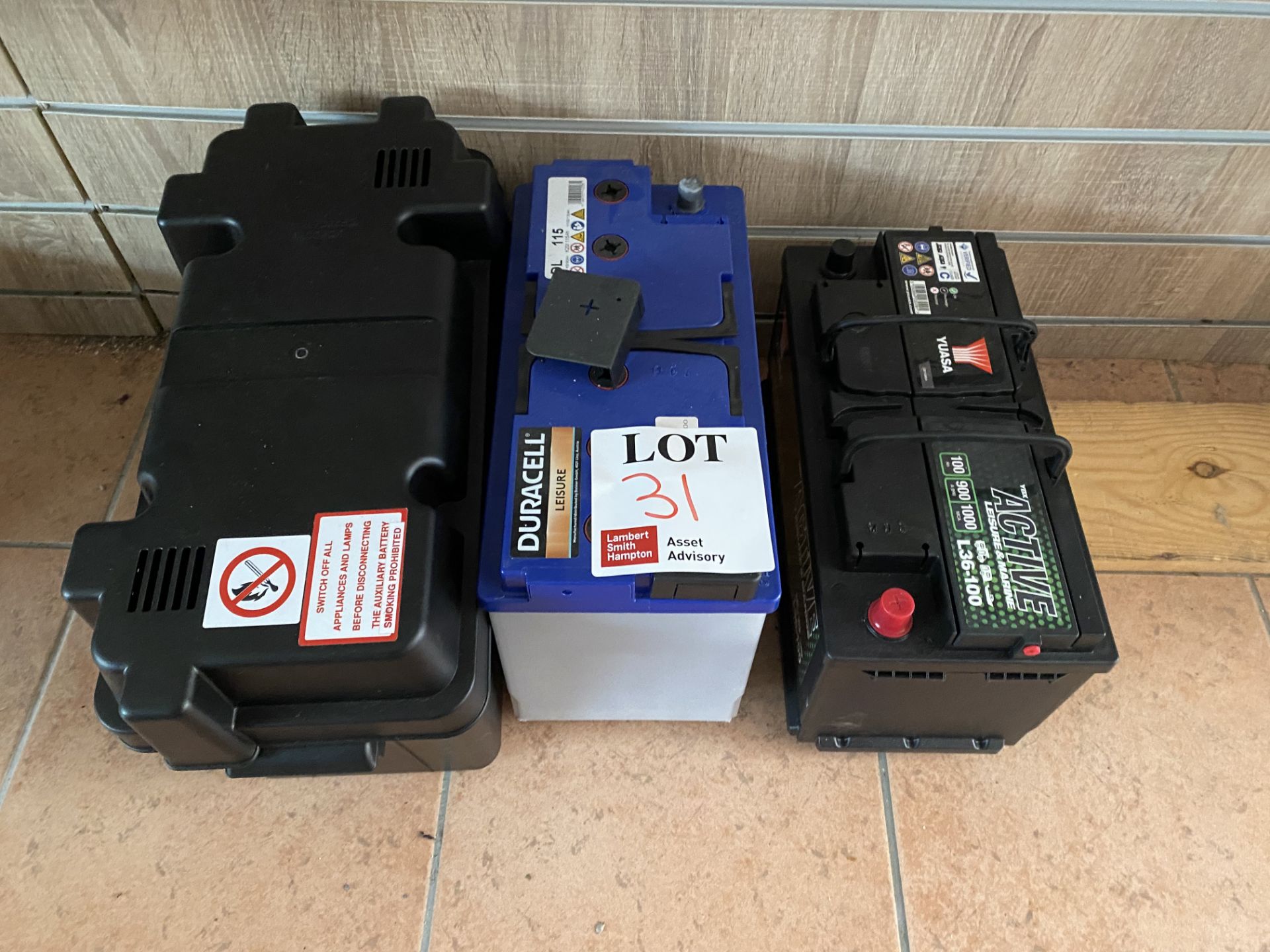 Two leisure batteries (one 115AH and one 100AH) and battery box. (Working condition unknown)