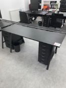 Six black metal frame adjustable office desks with six various pedestal units as pictured