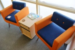 Two blue/orange cloth upholstered chairs and light oak effect circular coffee table