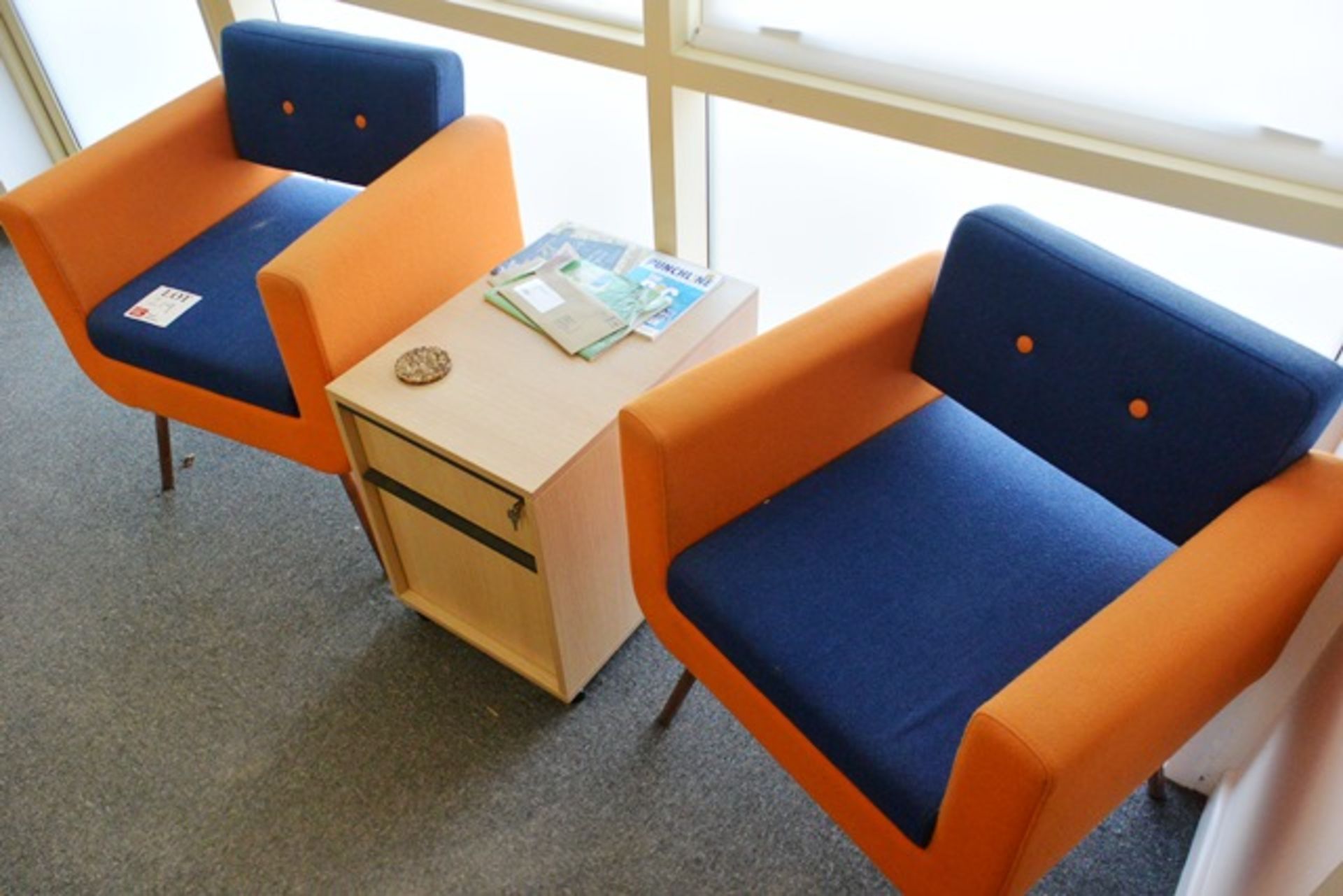 Two blue/orange cloth upholstered chairs