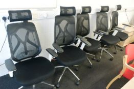 Six black mesh office swivel chairs