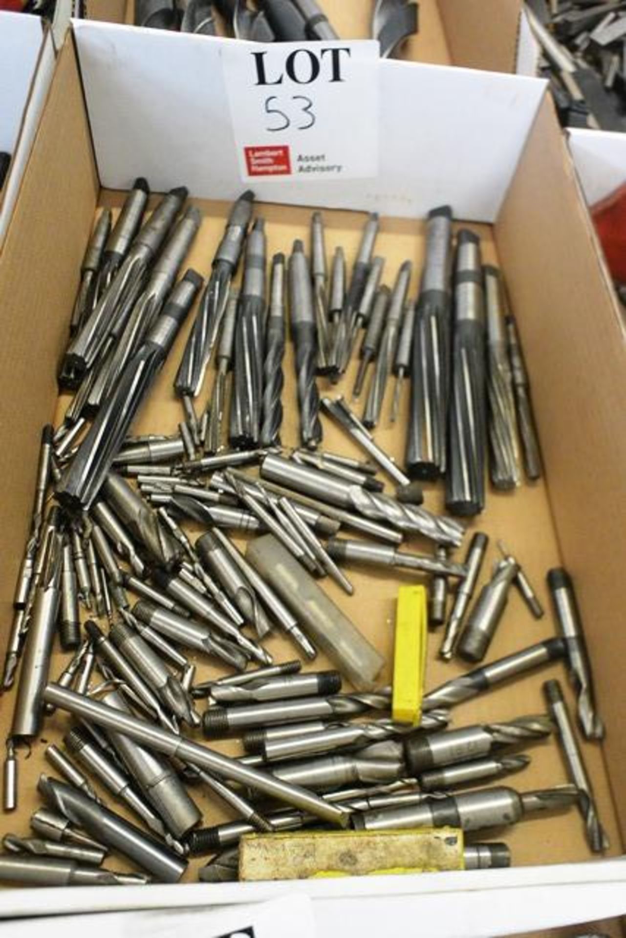 Box and contents to include various HSS taper shank/straight reamers, end mills (metric) (Please
