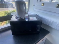 Codeworks Microwave oven and an unbranded 1.5 litre kettle (Working condition unknown)