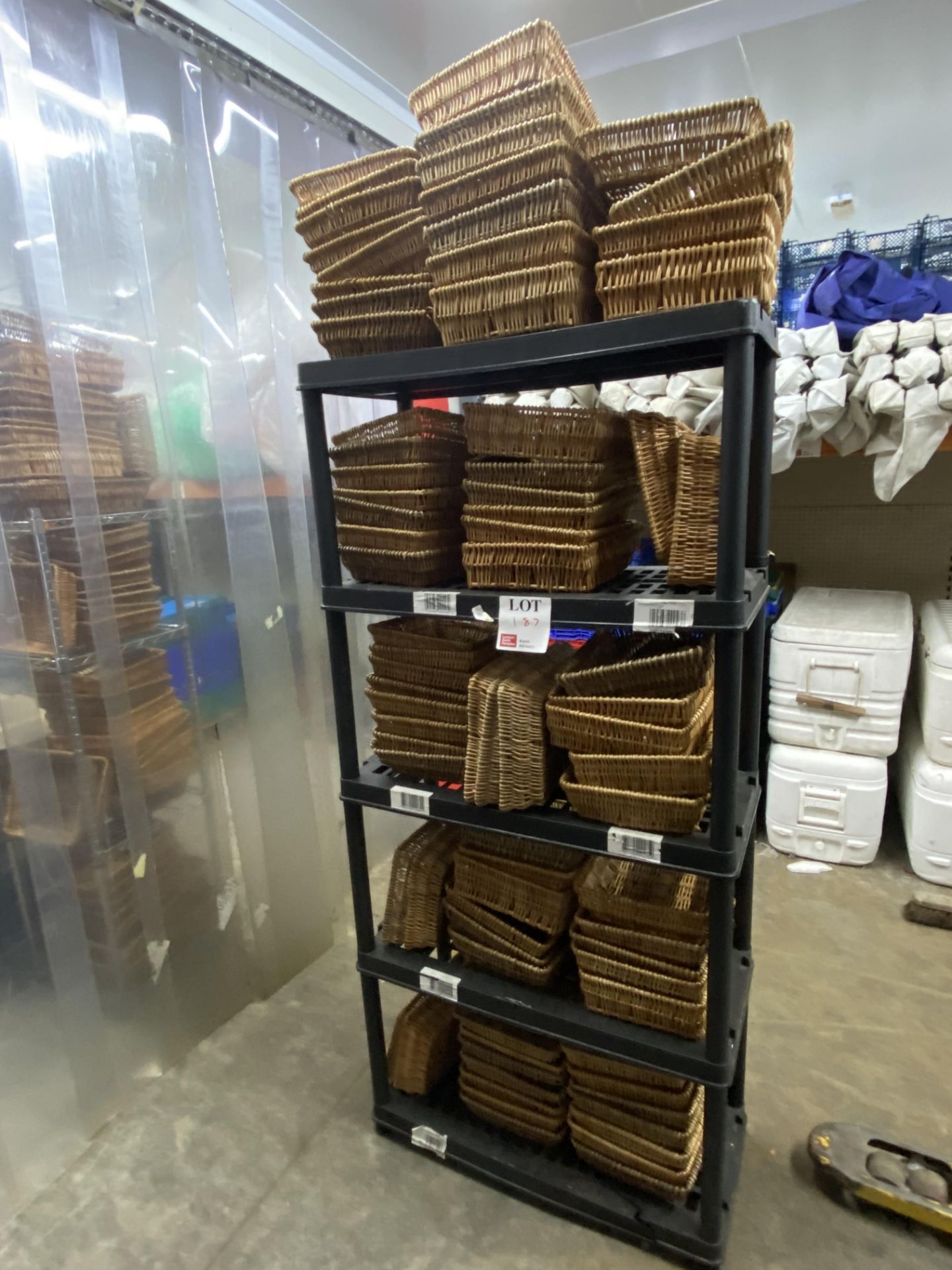 Plastic rack and contents to include various wicker trays