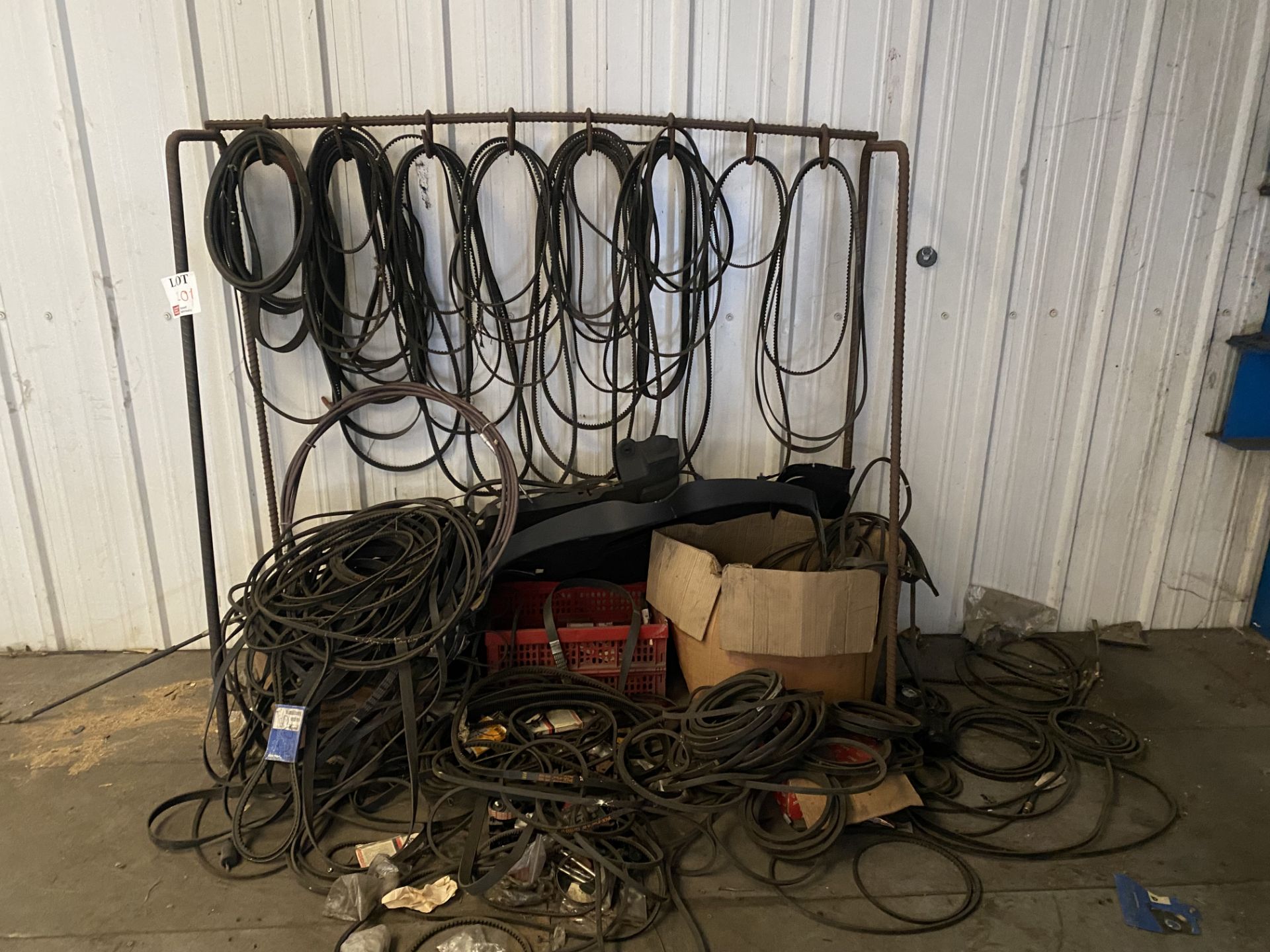 Assorted lot to include various rubber belts and metal frame