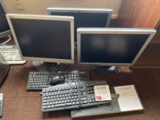 Three monitors with keyboards & mice