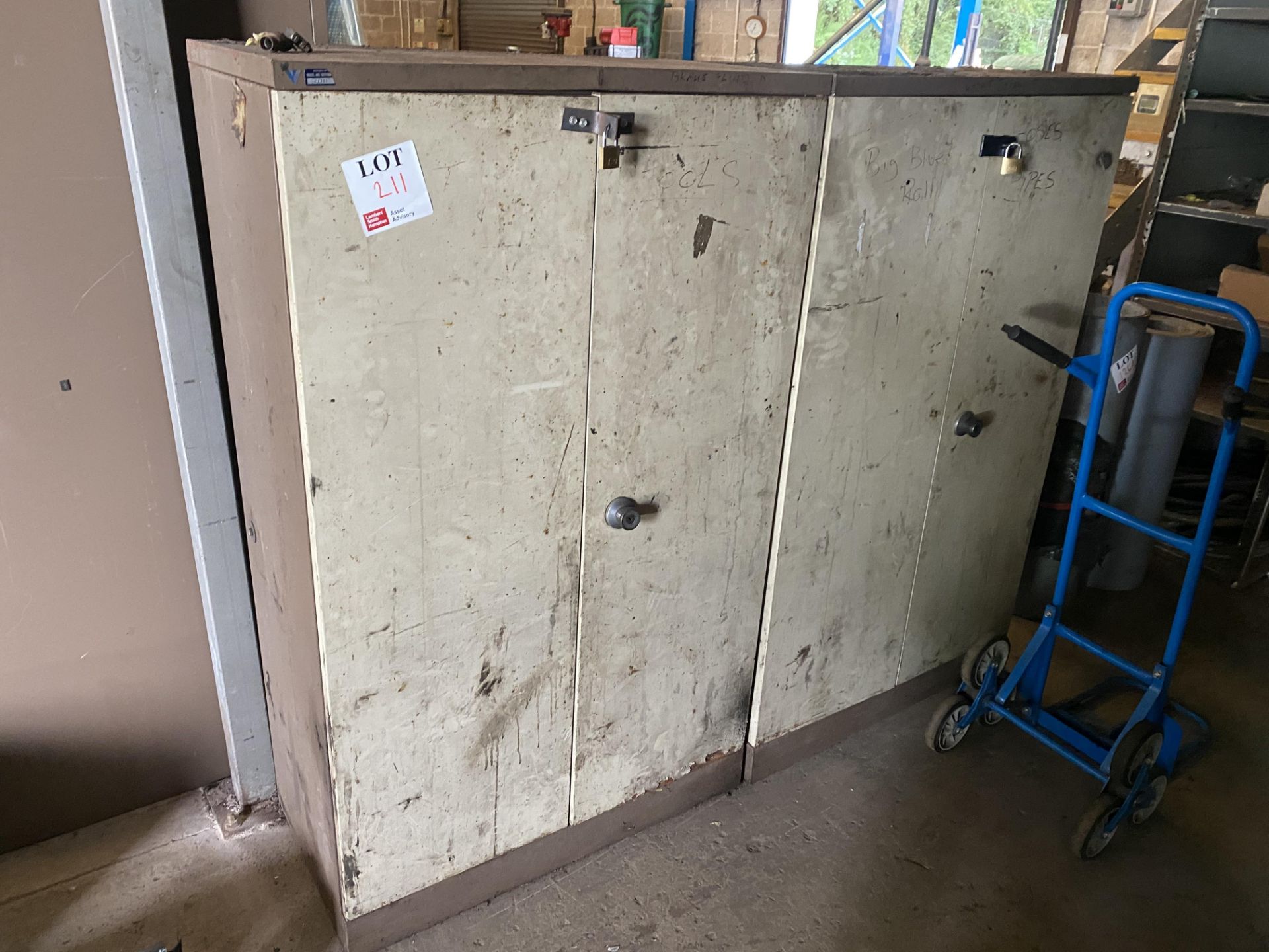Two double door metal storage cabinets, unlocked, no keys