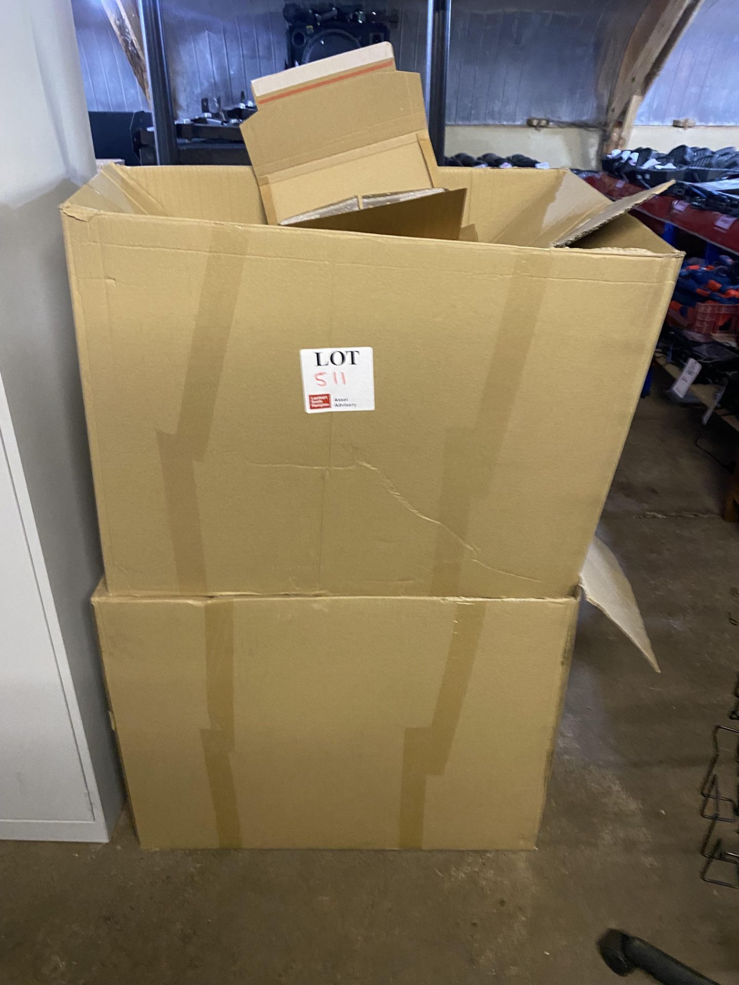 Two large boxes of assorted media wrap packaging