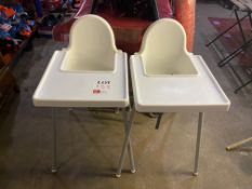 Two plastic highchairs