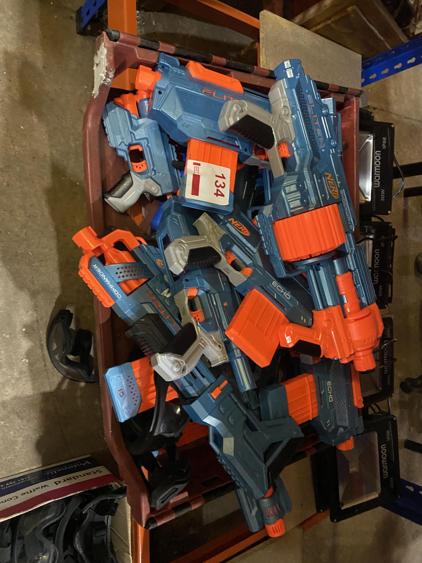 Crate of assorted Nerf guns and goggles