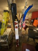 Assorted tools including spirit levels, squeegees, pick axe, rack, shovels, drain rods, post hole
