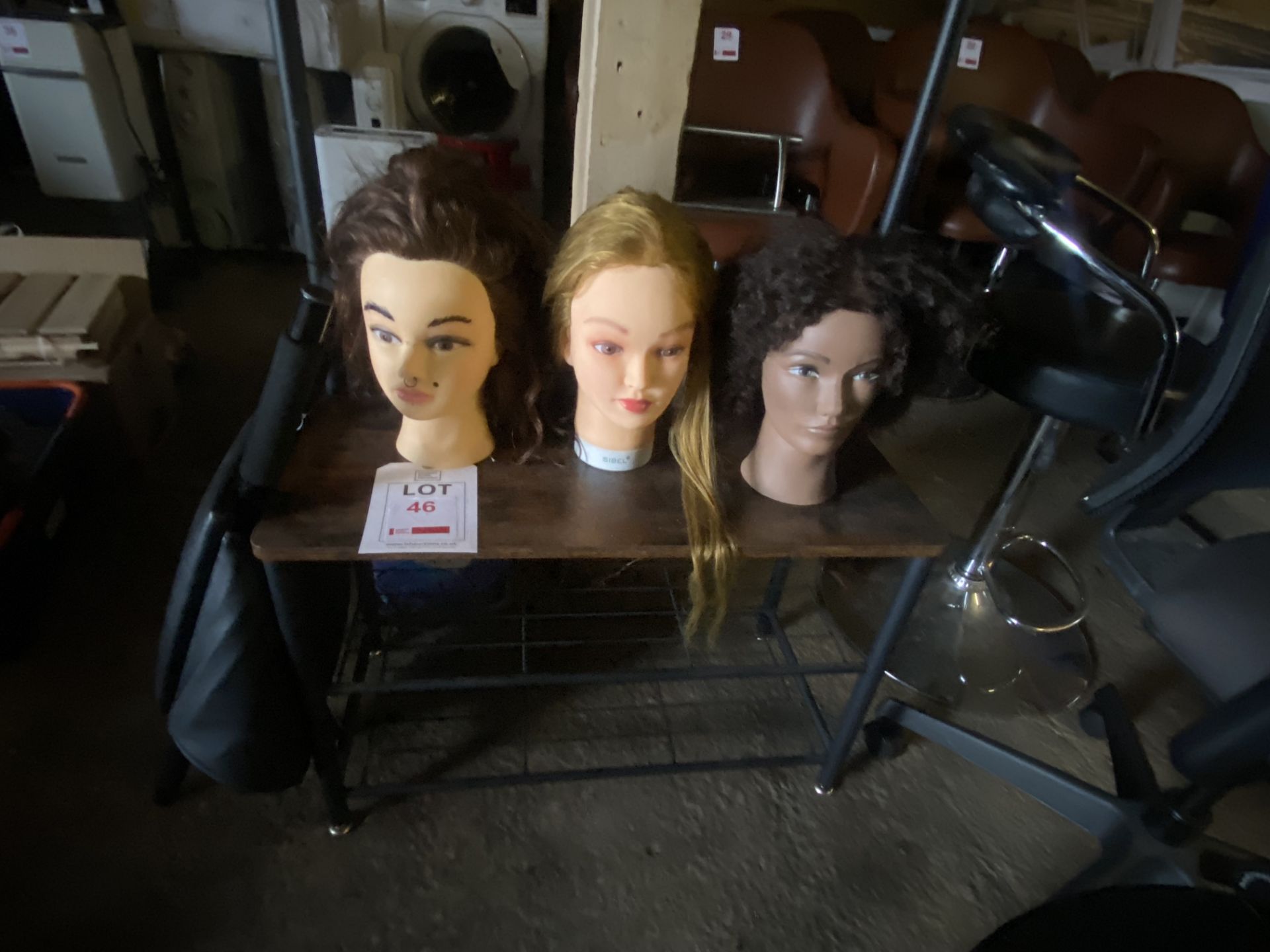 Three various hairdressing training heads and child's booster seat - Image 2 of 3