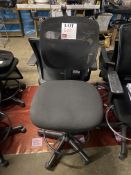 Three upholstered office chairs