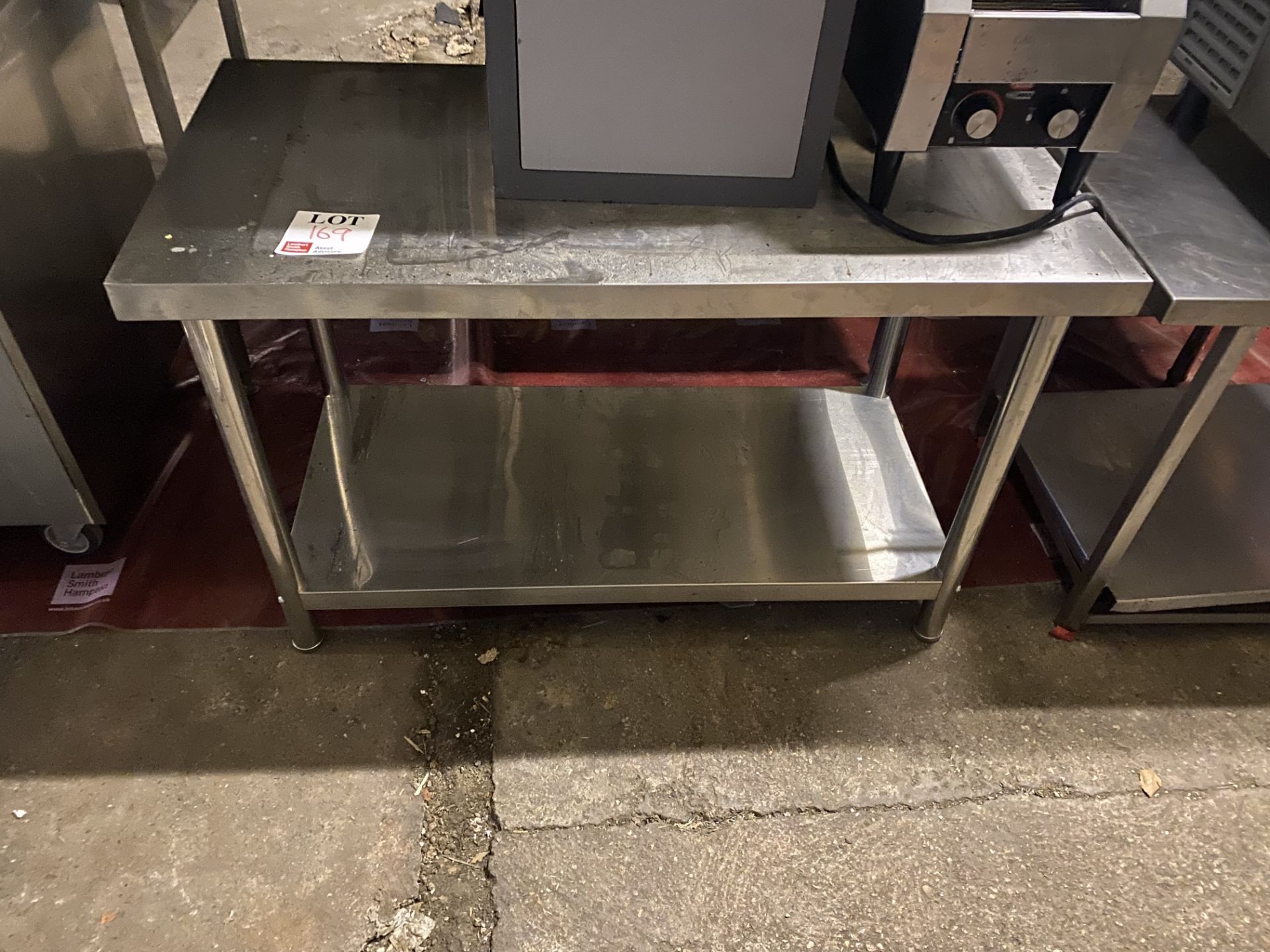 Stainless steel workbench with under counter storage, approx 77 x 120 x 60cm