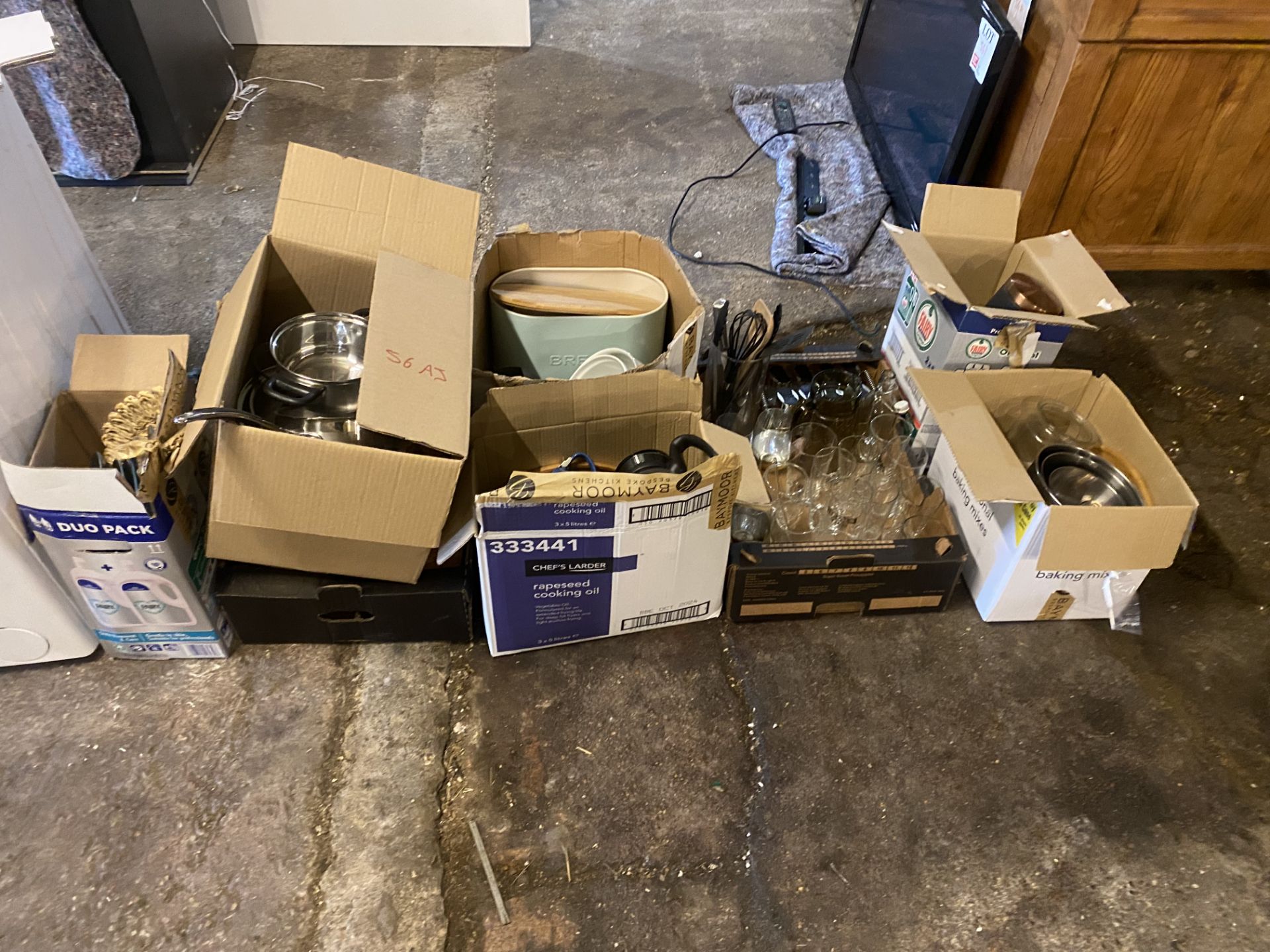 Miscellaneous lot including pots, pans, chopping boards, glassware, storage jars, etc.