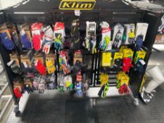 Contents of rack to include large quantity of various motocross gloves as lotted