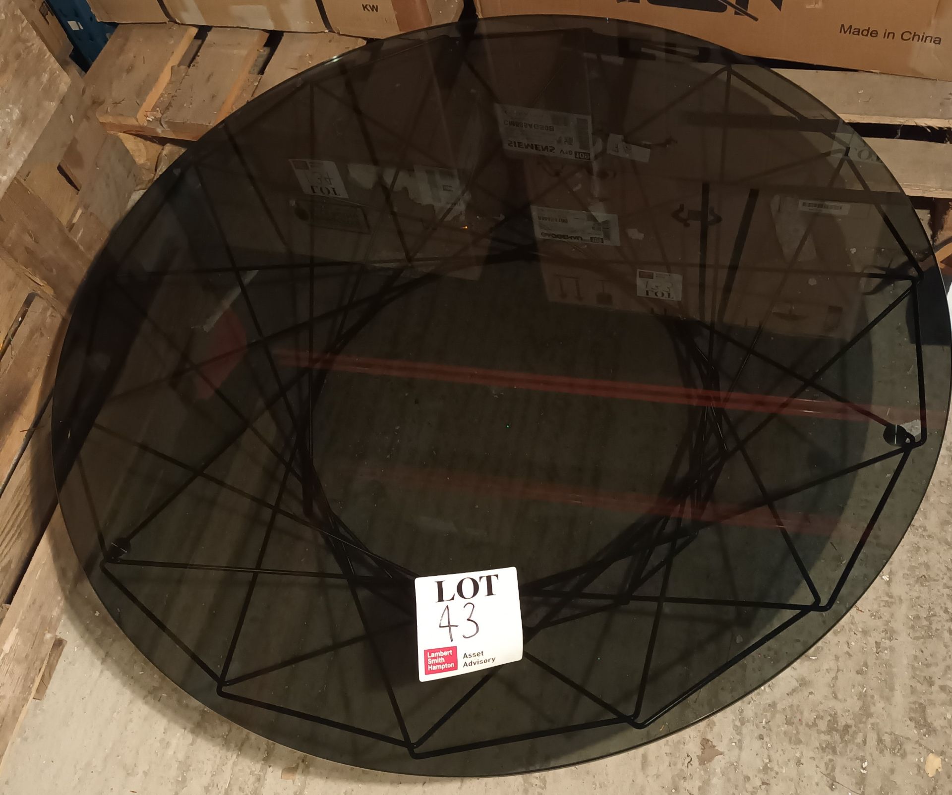 Glass top with black frame base coffee table (Located: Billericay)