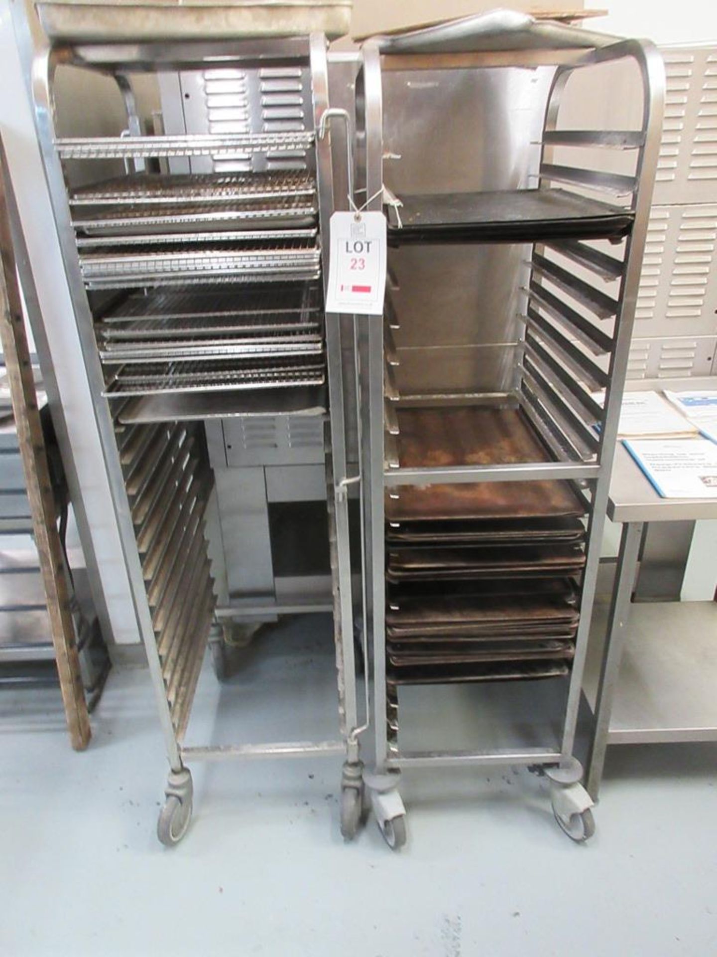 Three multi shelf stainless steel mobile racks