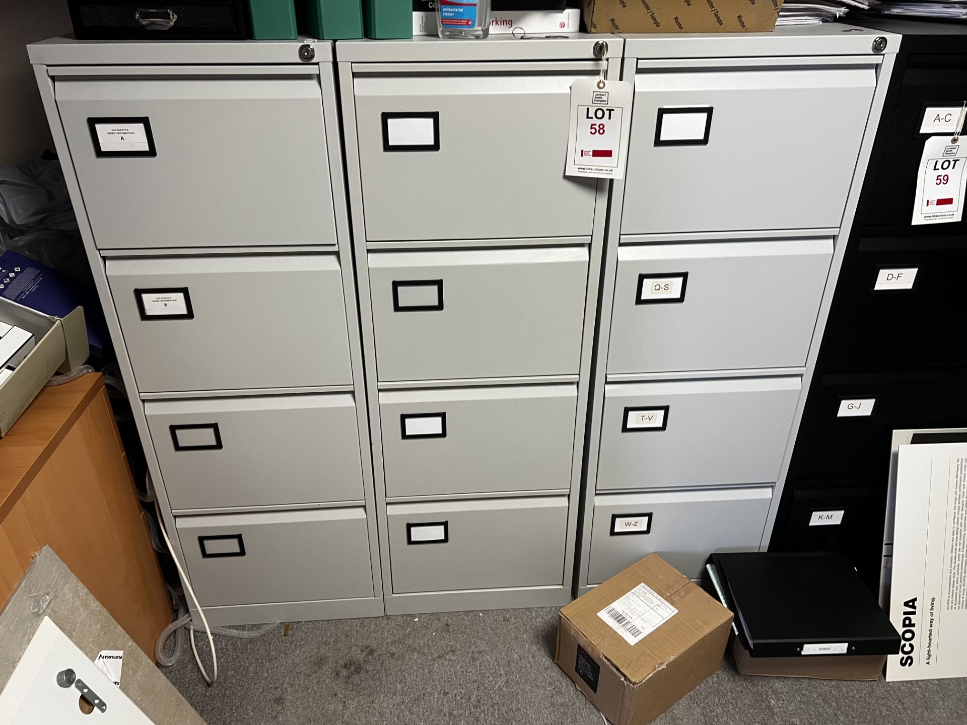Three grey, 4 drawer filing cabinets (2 with keys)