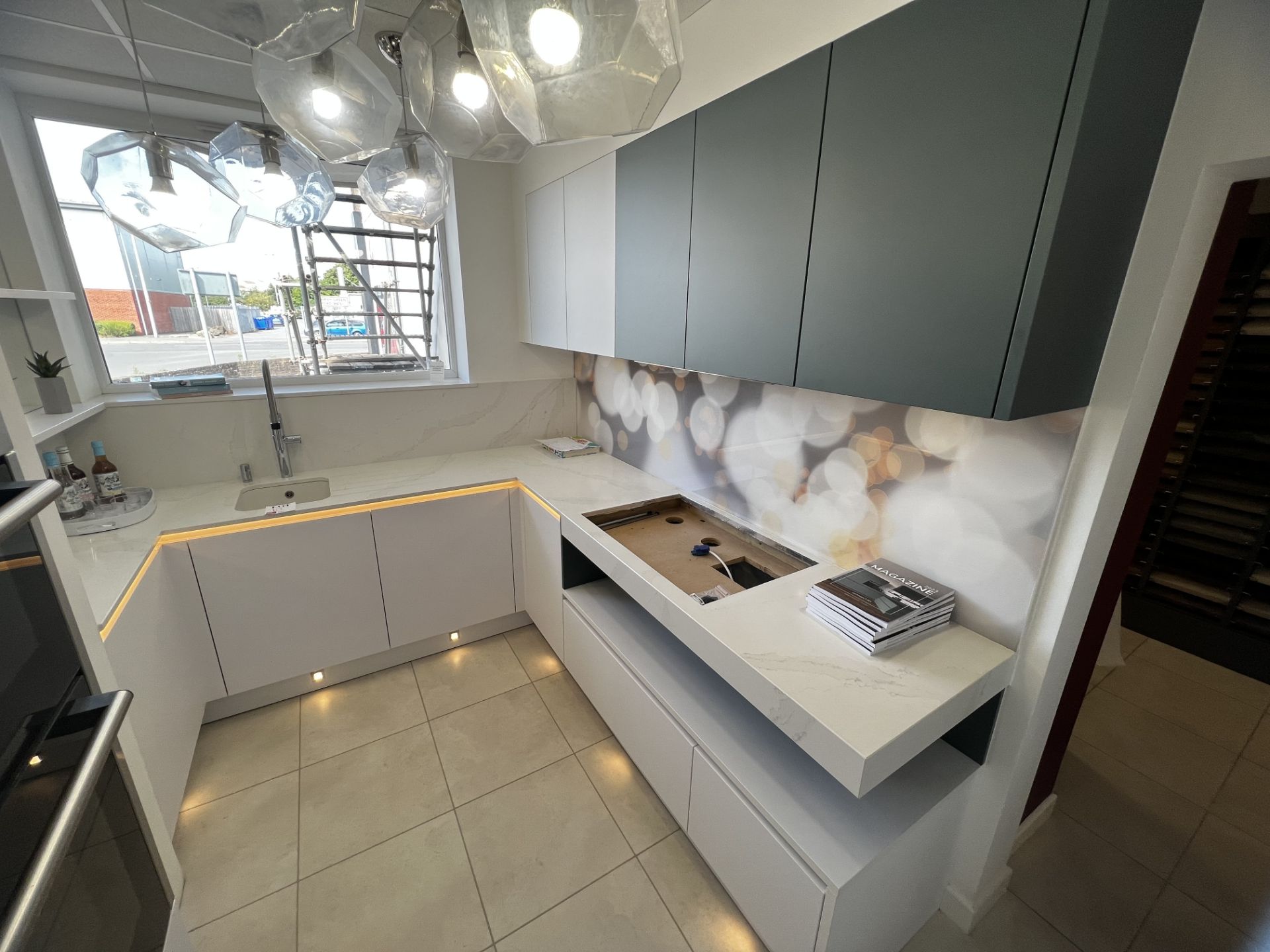 Light marble and grey effect display kitchen to include built in sink, retail price £20,000 (not