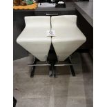 Two cream leather effect stools
