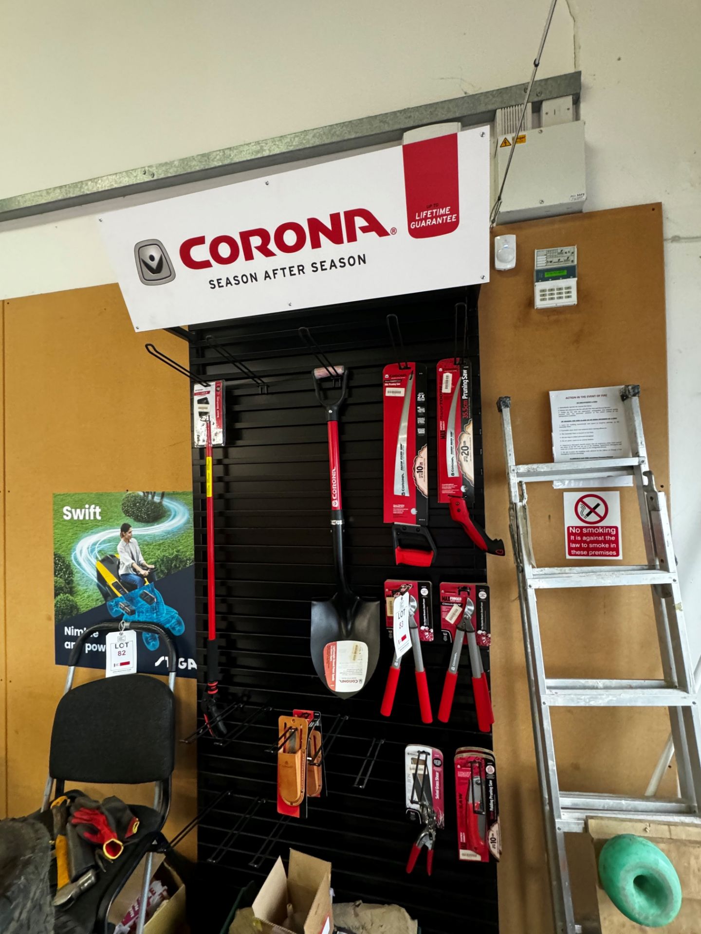 Corona display stand with contents to include pruner, spade, saws, grass shears, etc., approx height