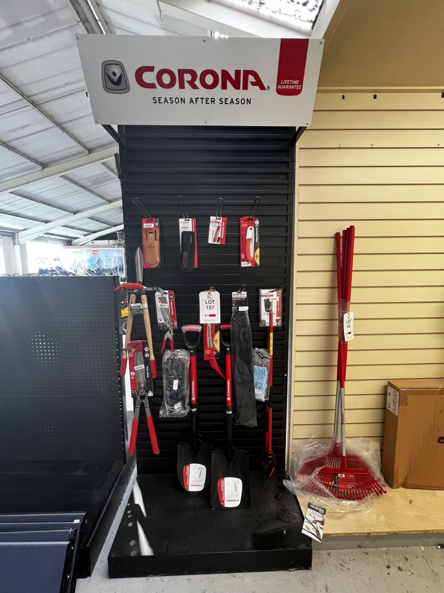 Corona stand, with contents including: two shovels, spade, two long reach pruners, hedge shear,