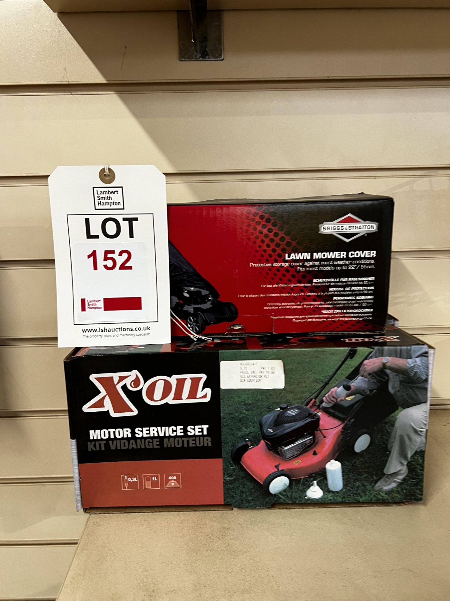 One lawnmower cover and two motor service set kits (this lot is located at Portreath)
