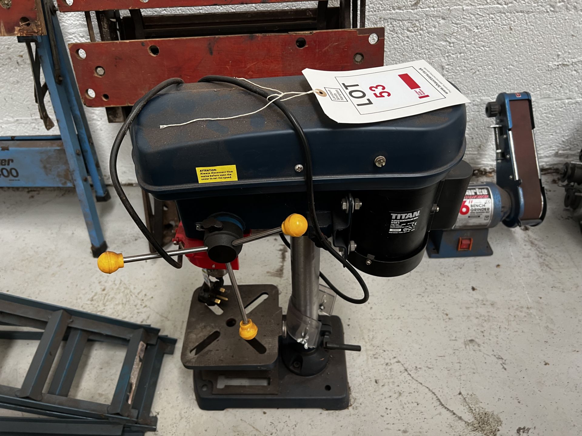 Titan 9 speed SF16N-9 pillar drill, Clarke 6" bench grinder (This lot is located in Plympton)
