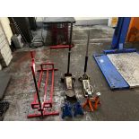 Lifting equipment to include red manual lift, two trolley jacks, two sets axle stands