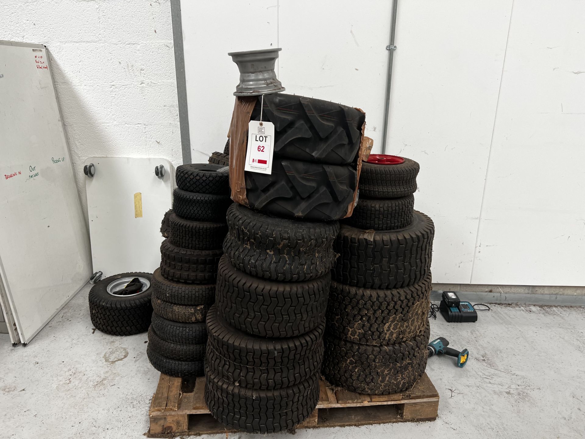 Pallet of generic ride on lawnmower tyre and wheel combinations, approx 32 (This lot is located in