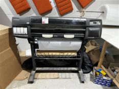 HP Designjet 1055cm Plus printer with paper rolls