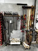 Contents of wall rack to include G clamps etc.