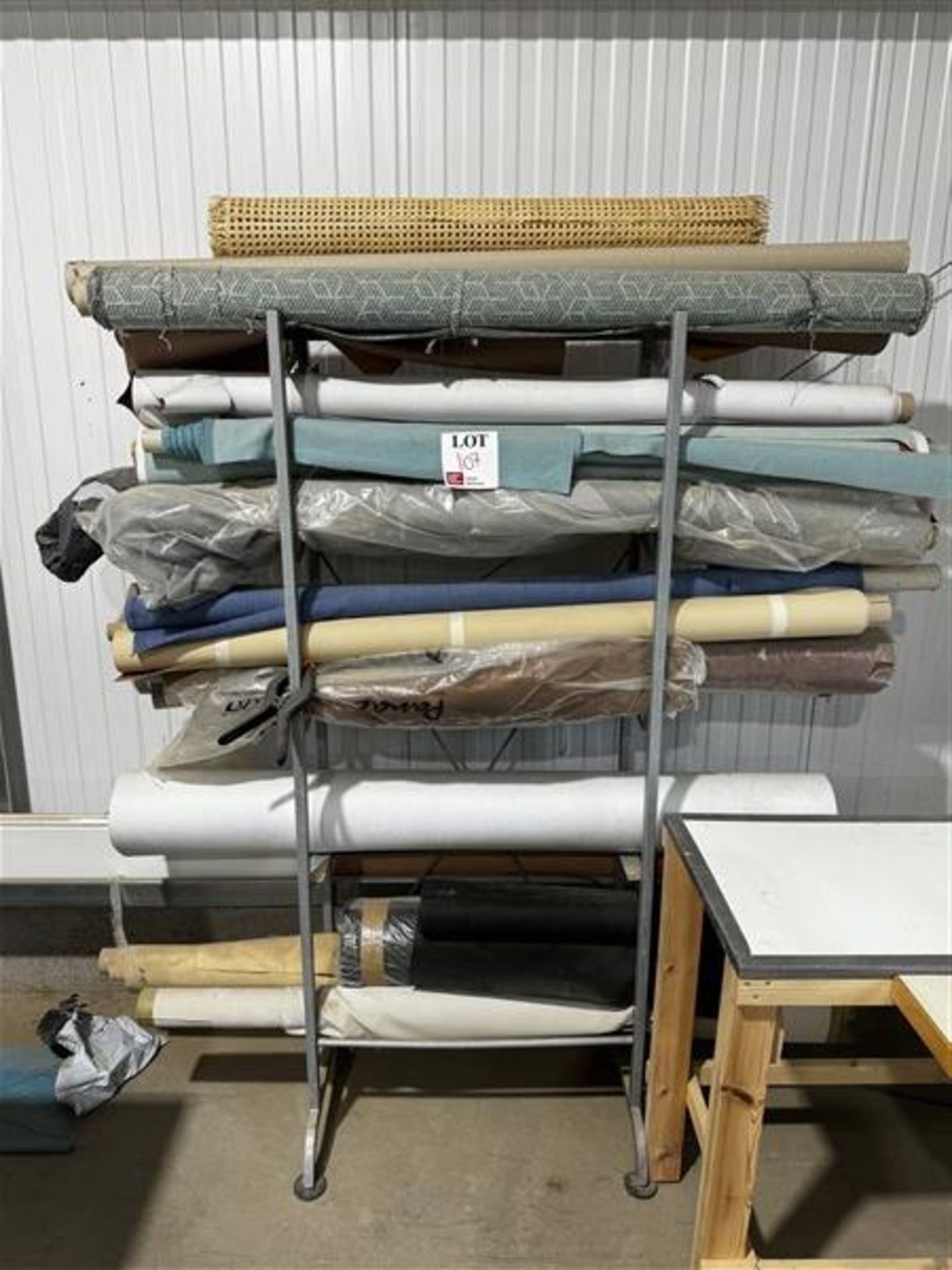 Assorted textiles and rack