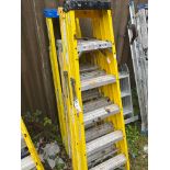 four sets of fibreglass step ladders