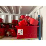 Shelf containing various fire safety alarms etc
