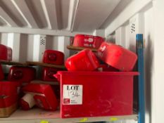 Shelf containing various fire safety alarms etc