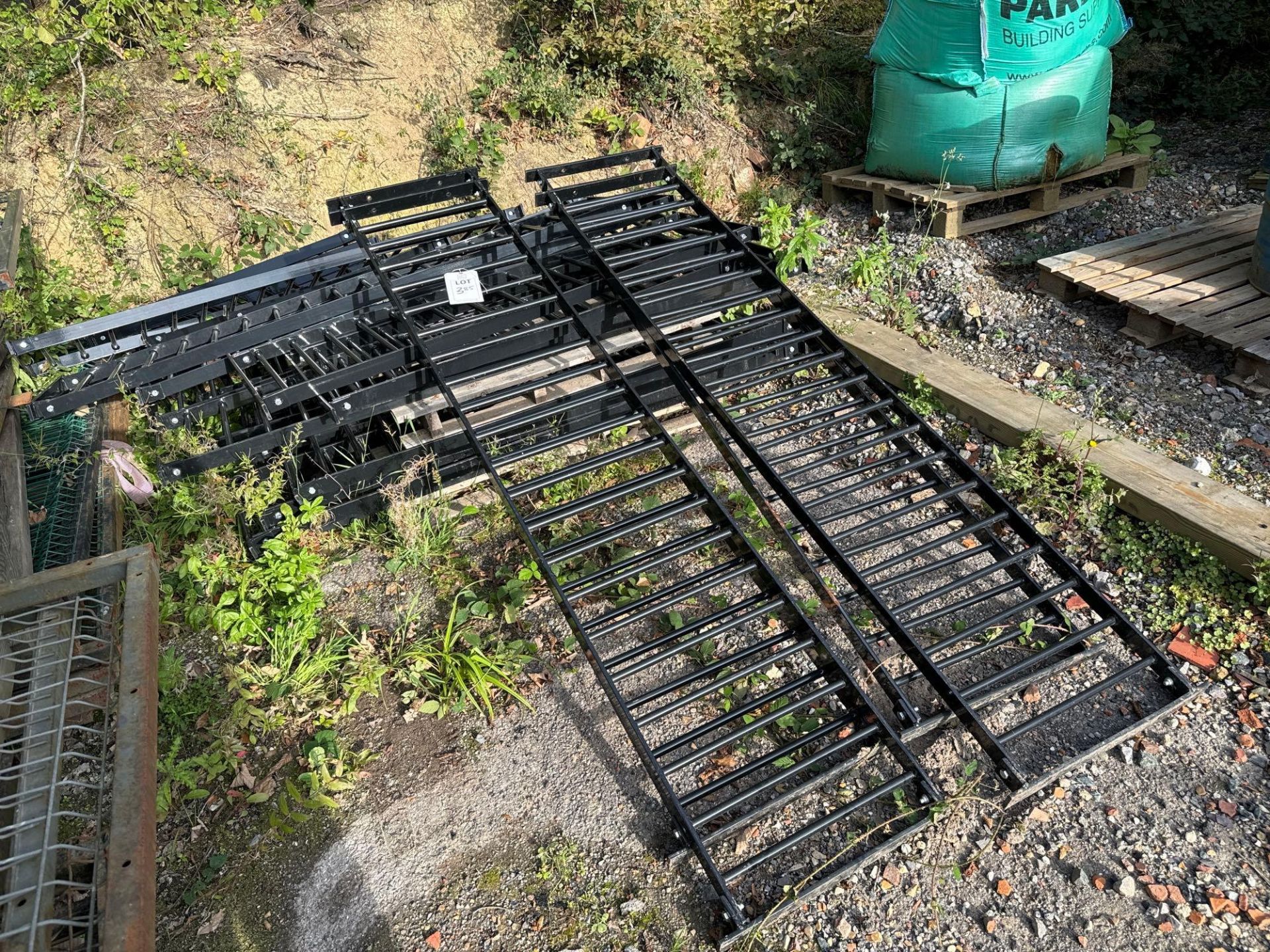 Pallet comprising black powder coated wall fence