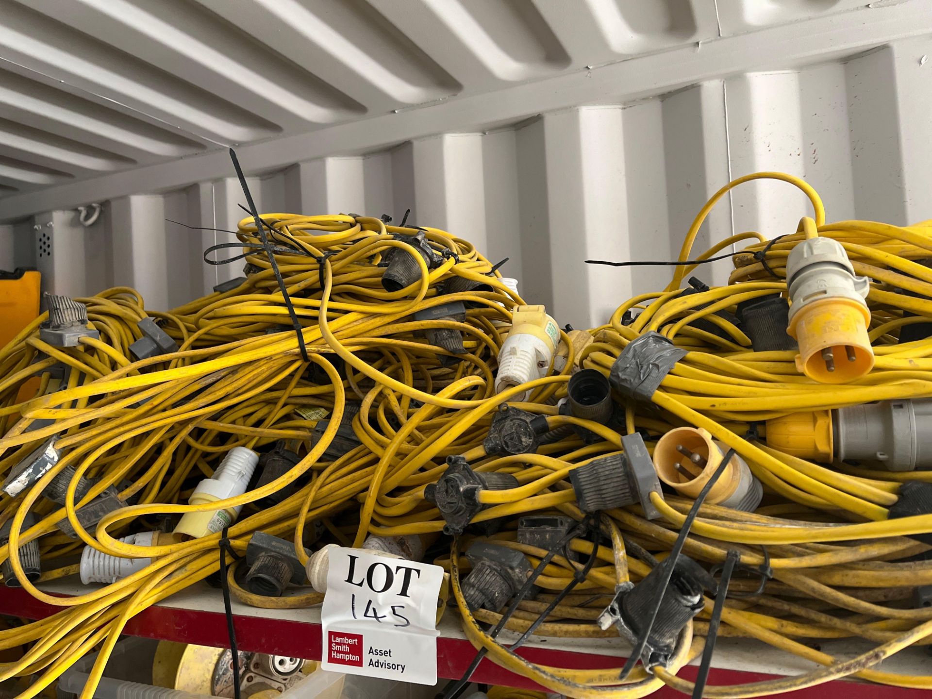 Contents of shelf - various 110v cables as lotted