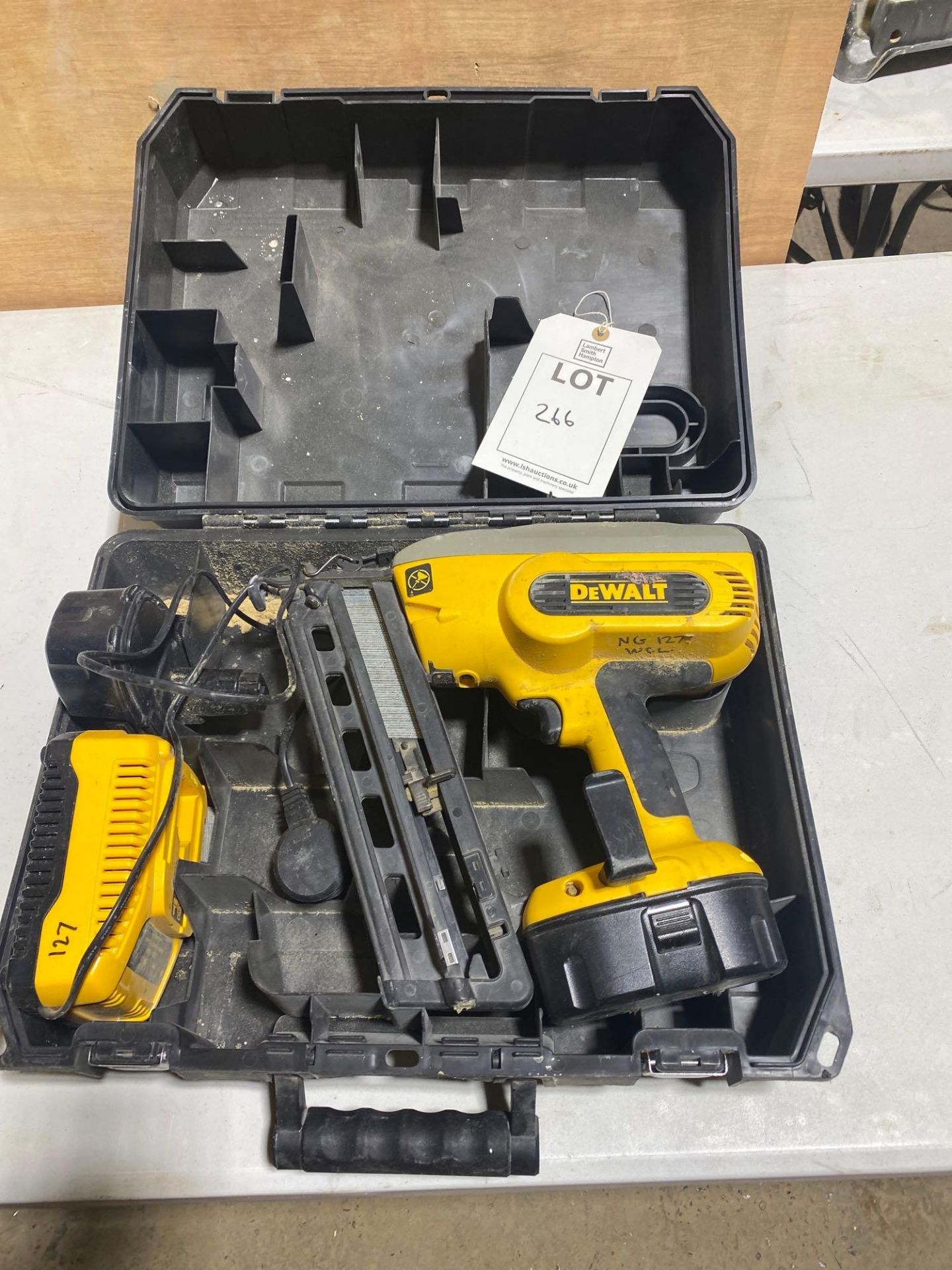 DeWALT cordless nail gun complete with charger and 2 batteries