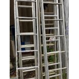 Two double aluminium ladders and 3x single sections