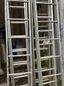 Two double aluminium ladders and 3x single sections