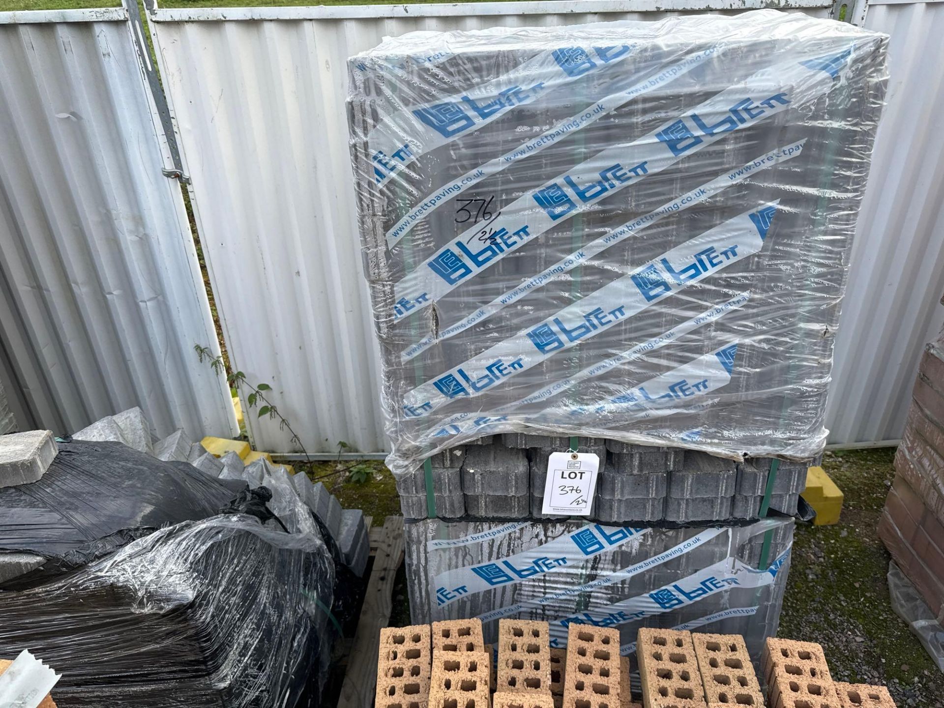 Two and a half pallets of grey Brett paving bricks