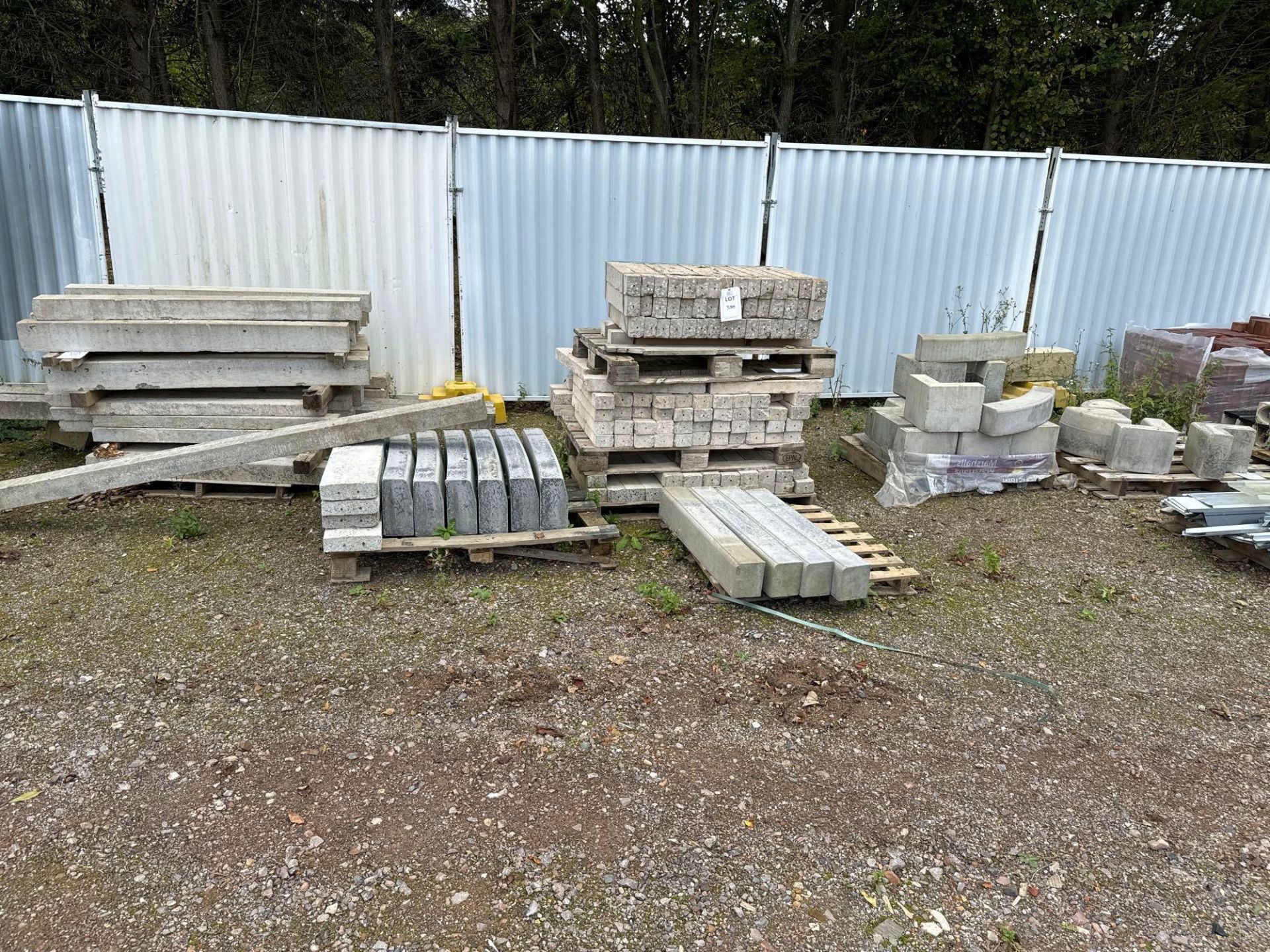 Various concrete lintels and kerb stones as lotted