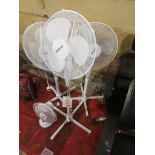 Three pedestal fans, 1 x desk fan