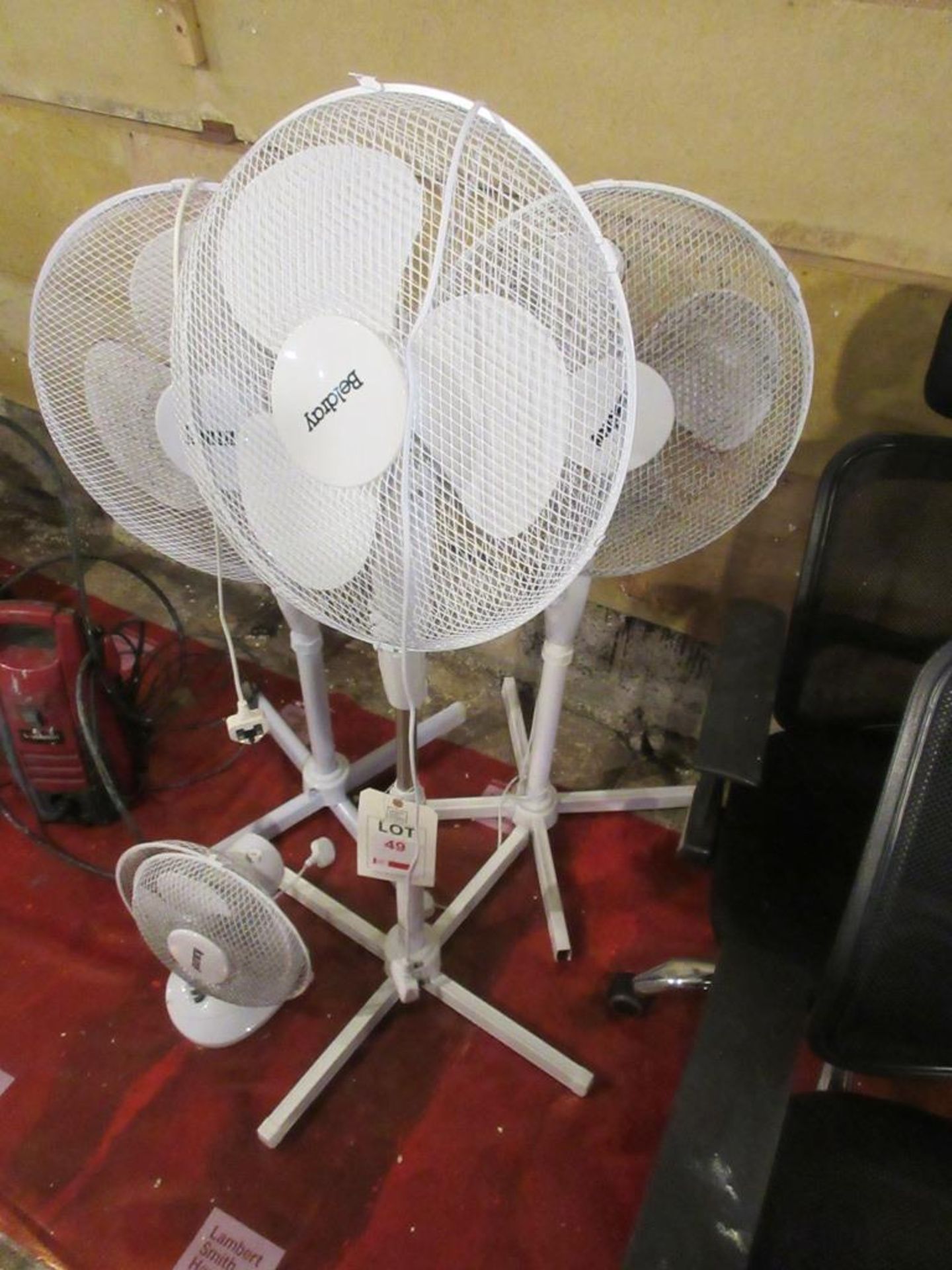 Three pedestal fans, 1 x desk fan