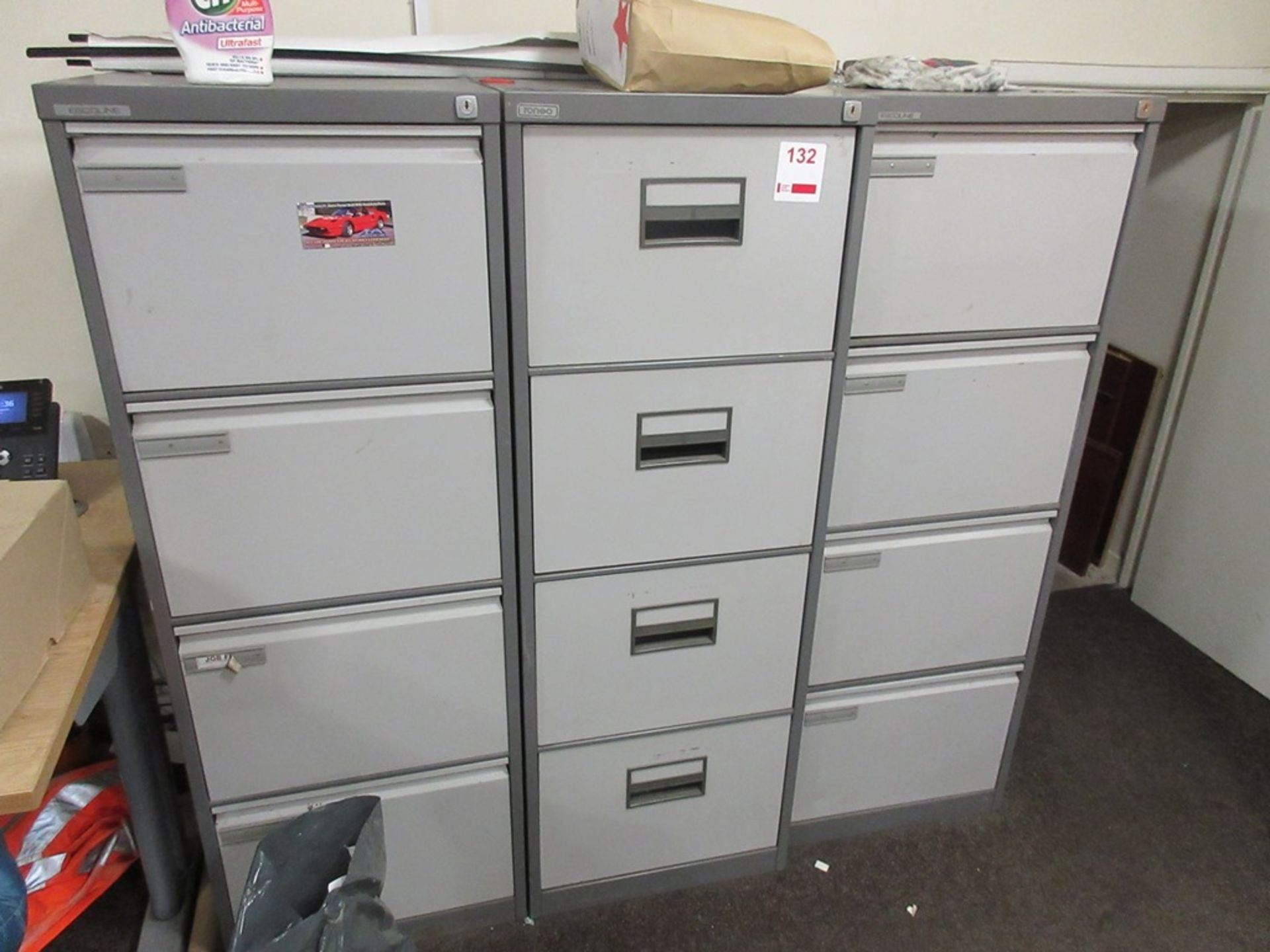 Three steel 4-drawer filing cabinets