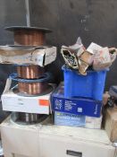 Nine assorted boxed and part used reels of welding wire, and tub of assorted welding rods